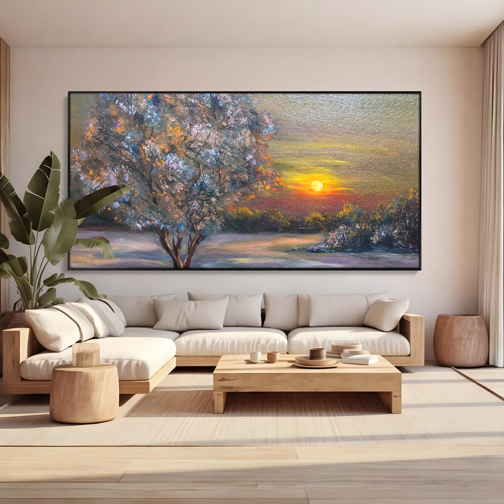 Tablou canvas cu pictura peisaj cu copac si apus, in rama de aluminiu negru, pe perete intr-un living